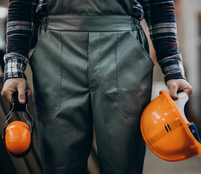 young-male-handyman-with-safety-earphones